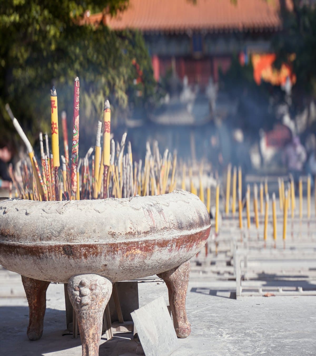 Sacred dhoop incense sticks burning in a temple urn